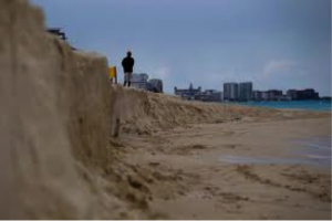 Figure 4. New dumped sand washing away on Cancun beach (Google images)