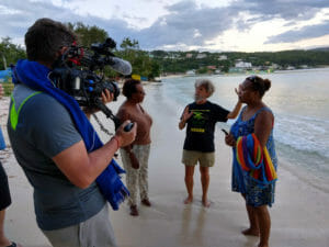 Goreau discussing dolphin pen pollution issues with local residents in Discovery Bay